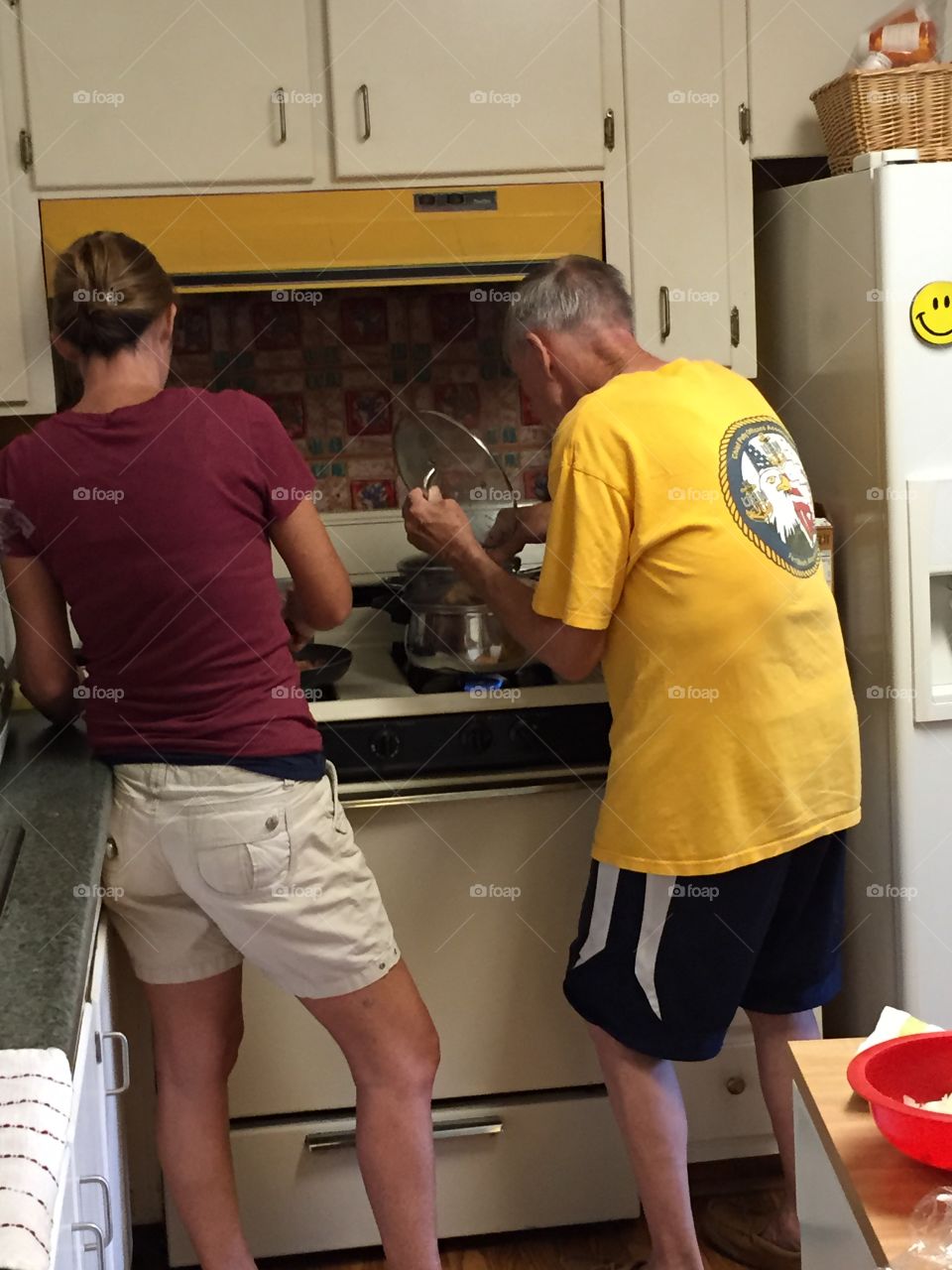 Father and daughter cooking during Holidays.