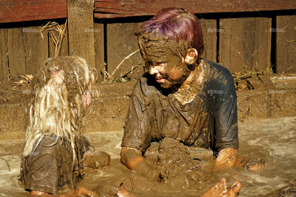 Boys Playing In Mud