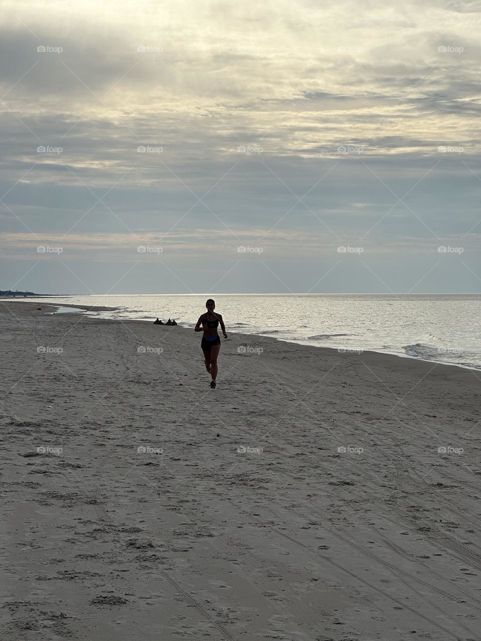 Woman running on the beach 