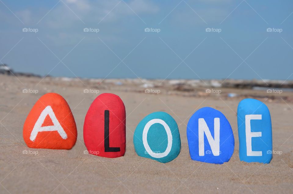 Alone concept on the beach, stones composition