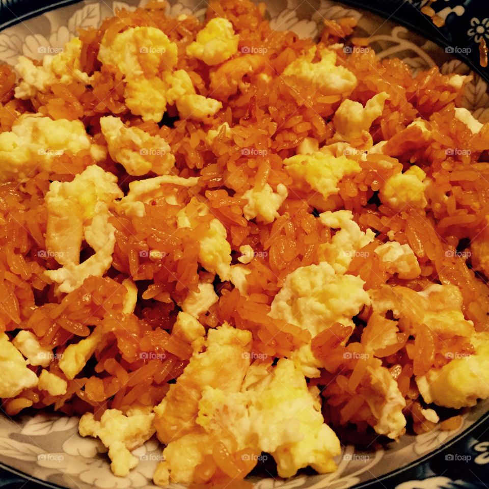 "Scrambled Eggs and Seasoned Rice"

The rich textures and vivid colors of the scrambled eggs and rice are the main focus of this photo. Definitely an eye appealing homemade dish