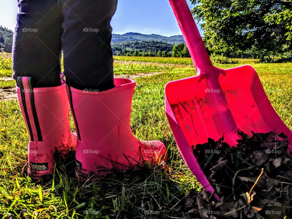 pink shovel and pink rainboots