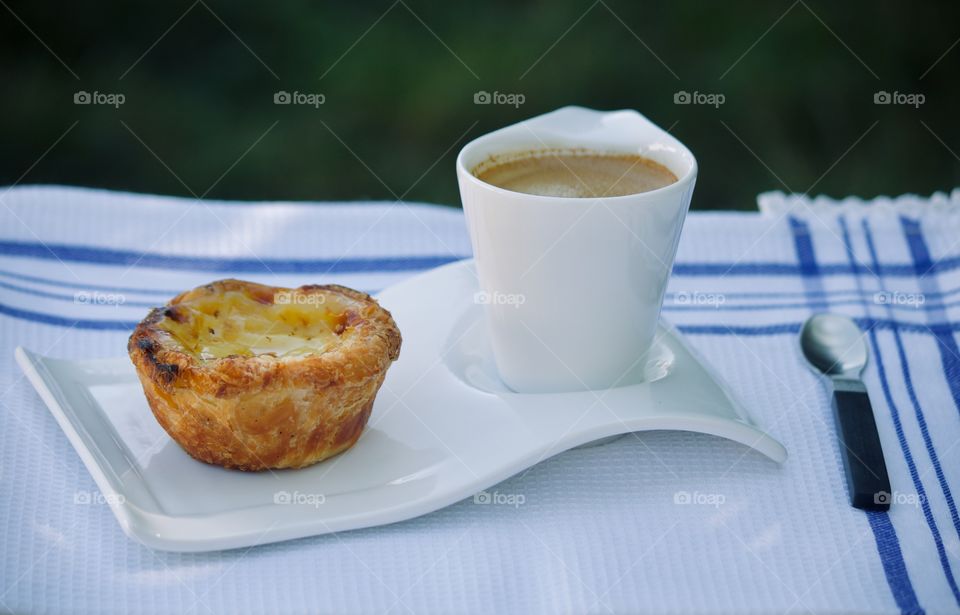 Egg pastry with espresso for breakfast 