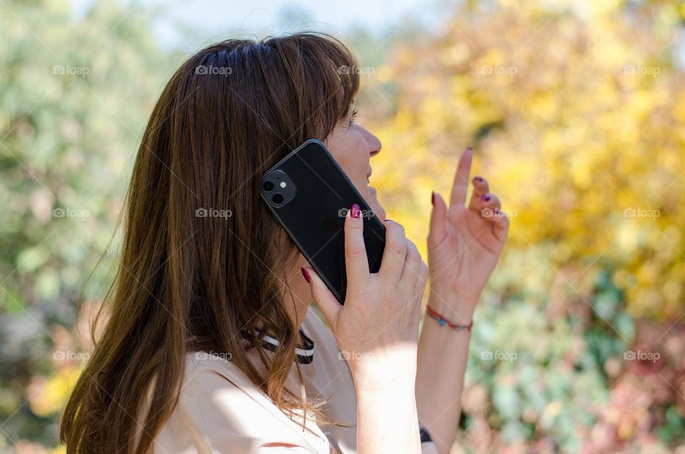 Woman tolking on Iphone