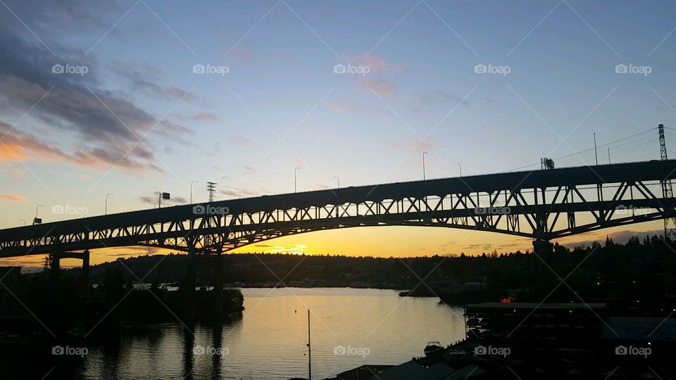 The view off a bridge, walking in University District overlooking Portage Bay on Lake Union, during the sunset. It was simply too good a view not to snap a picture.