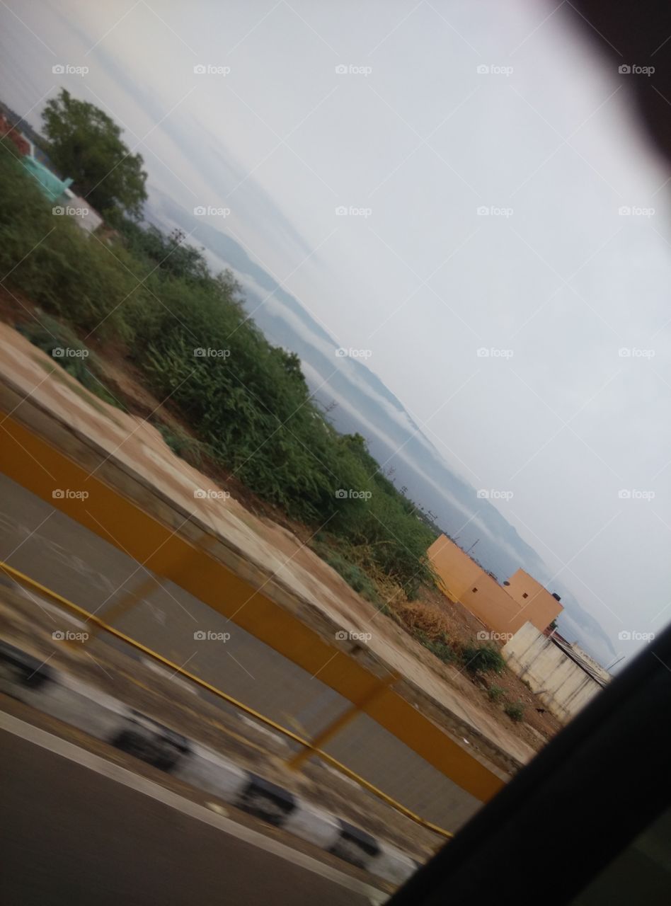 clouds floating on a hill in two rows.. captured while traveling