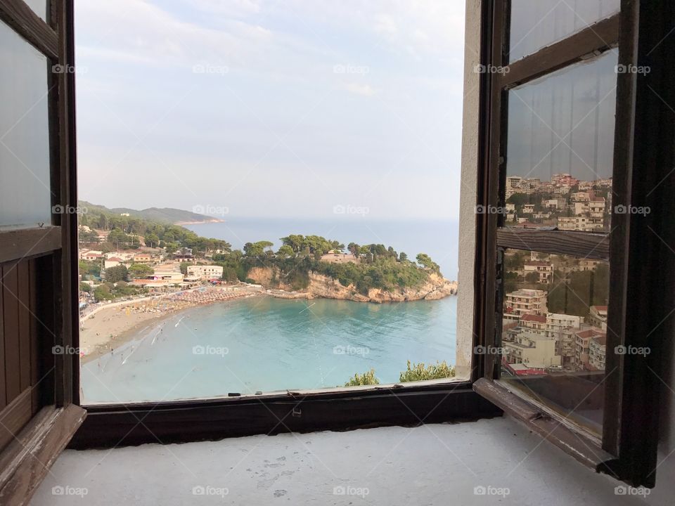 Beautiful window view at the beach and the sea in town Ulcinj of Montenegro.