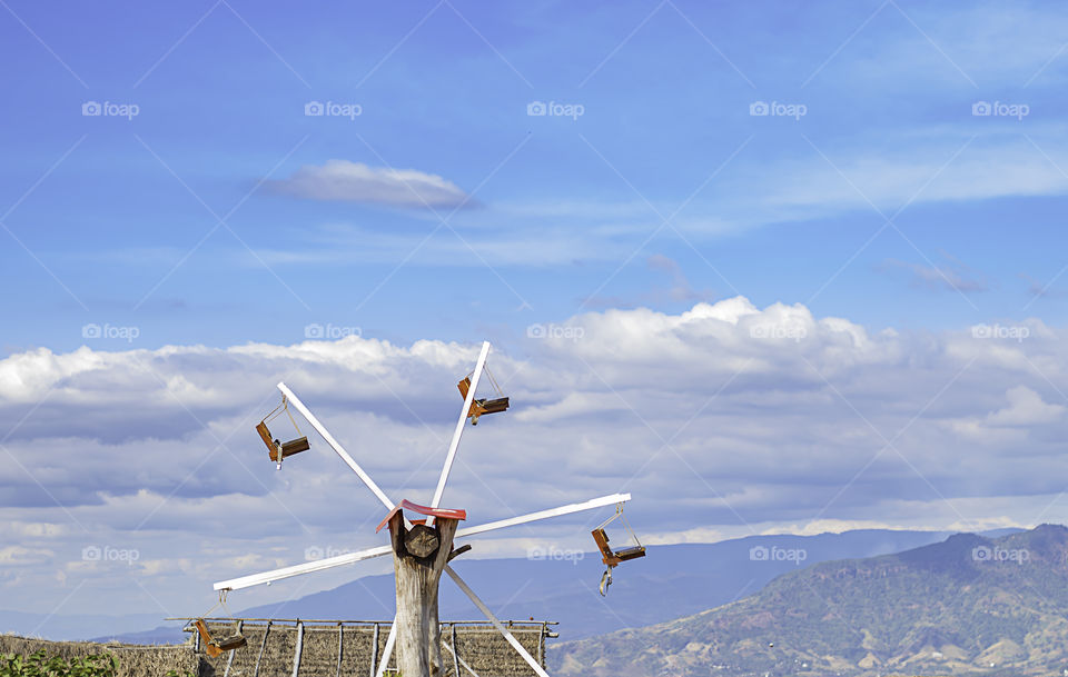 The wooden Ferris wheel and bright blue sky at Windtime Khao kho , Phetchabun in Thailand.