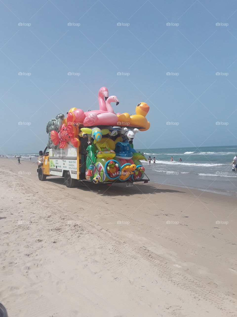 water float truck at the beach