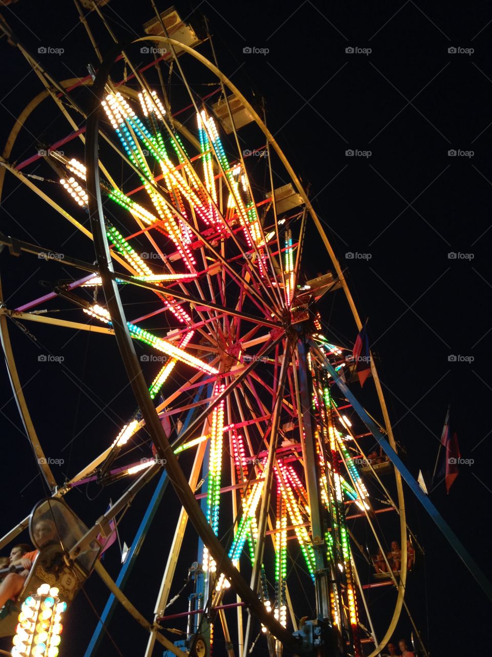 Illuminated ferris wheel at night