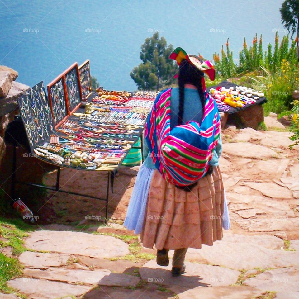 Ladies wear colorful clothing in Isla Taquile in Peru