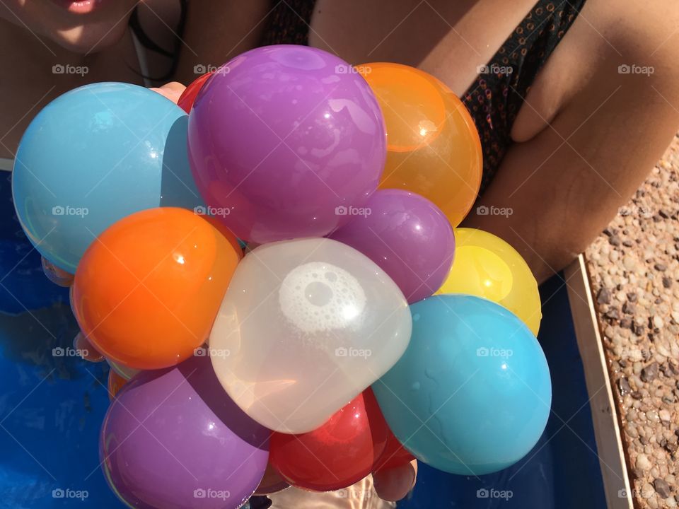 Water balloon bouquet. The girls had fun filling up the balloons and tying them together for this very colourful shot