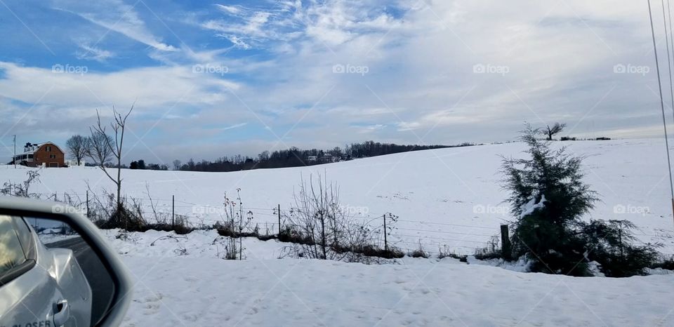 Roadside snow on a hill