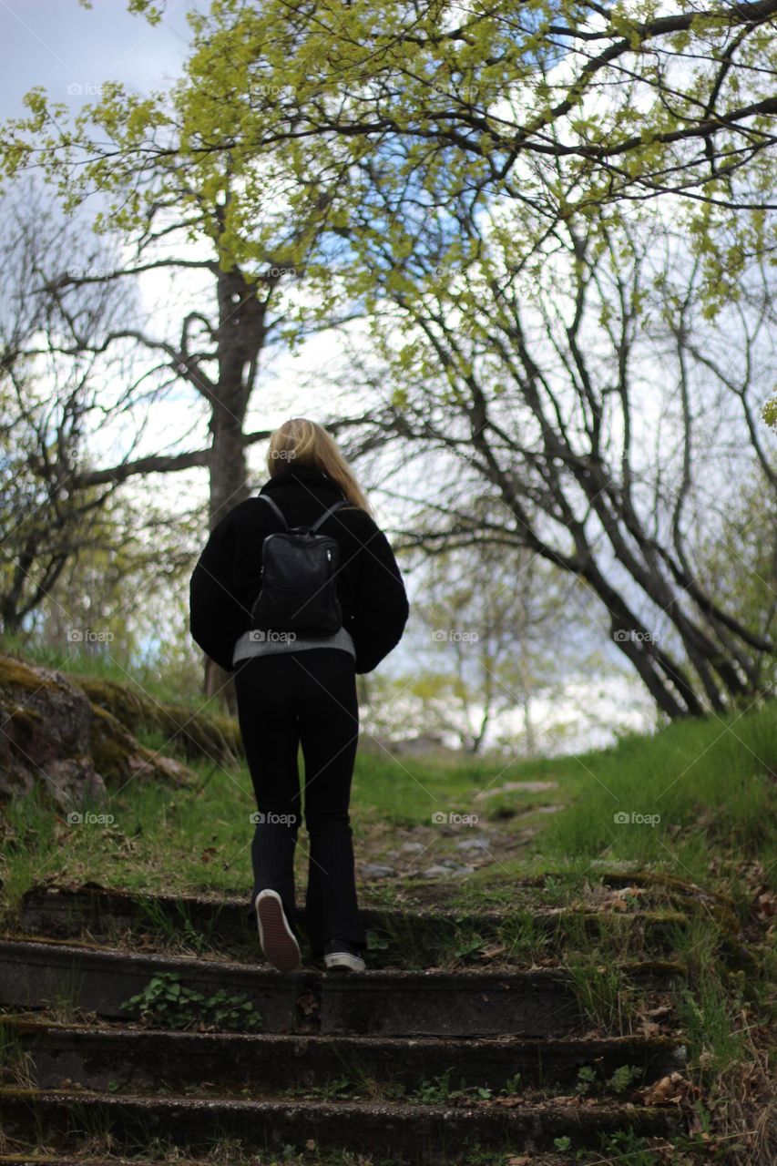 Girl climbing old stairs