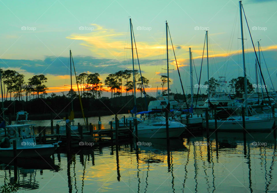 Scenic view of port during sunset