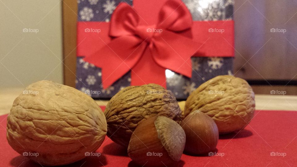 mixed nuts with present and bow in background