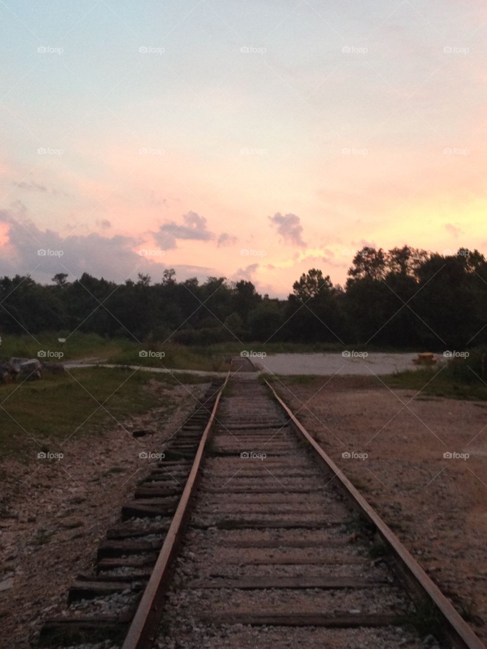 Train tracks into the sunset