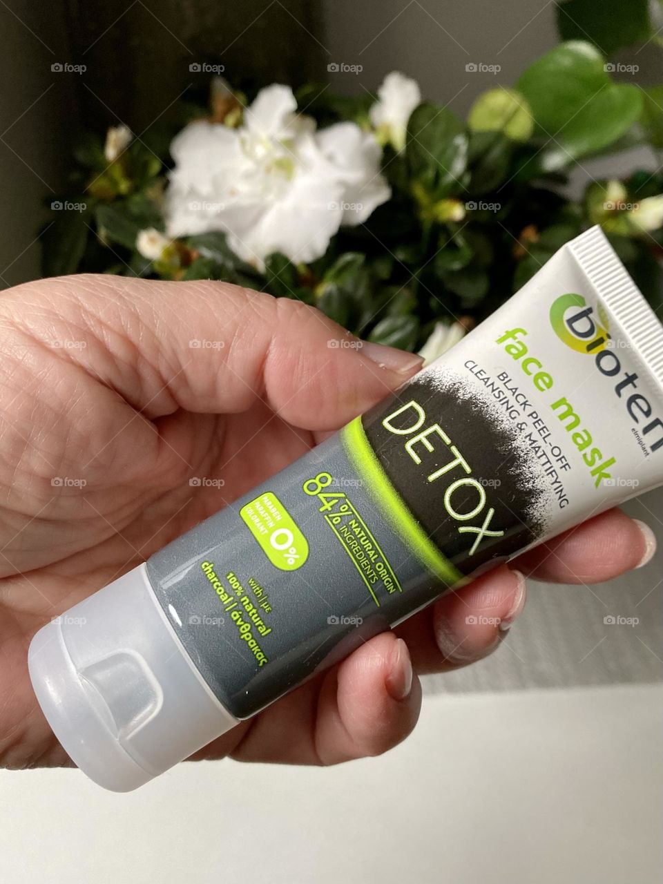 Hand holding face mask 