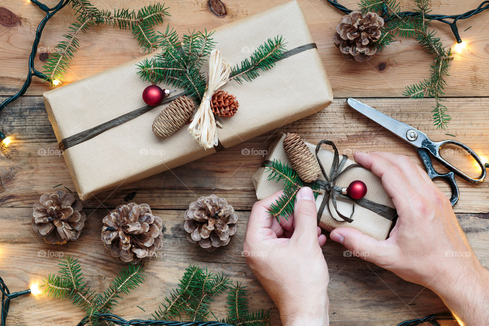 Decorating Christmas presents. Decorating wrapped Christmas presents