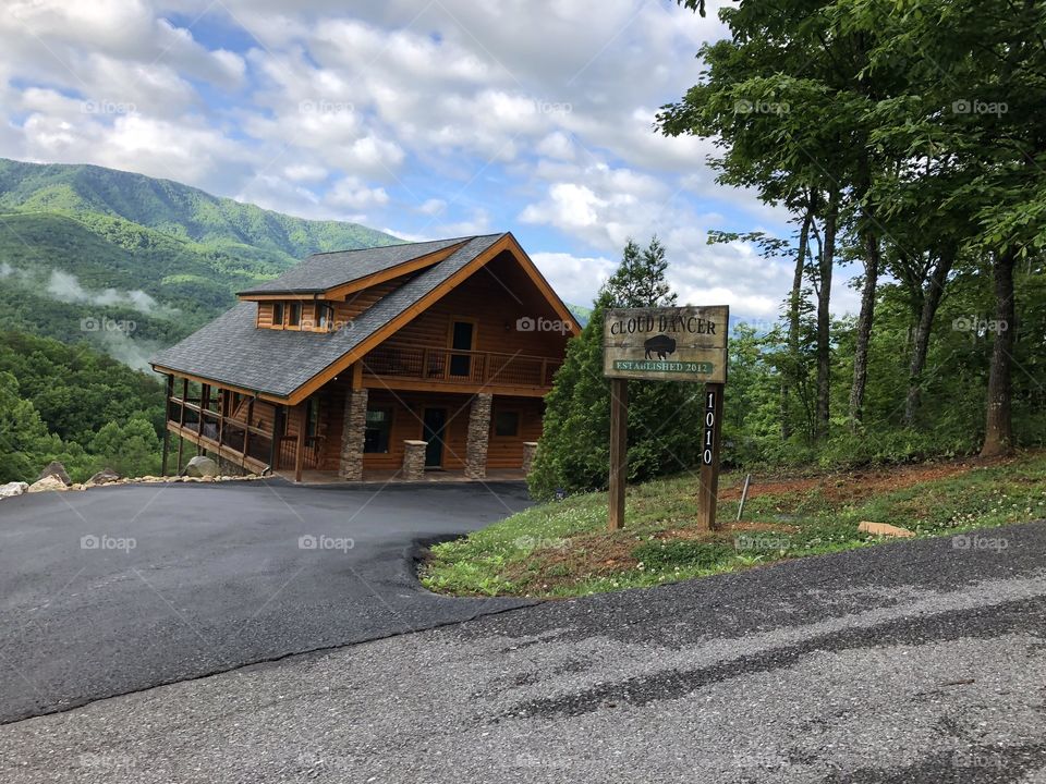 Cloud Dancer Cabin in Gatlinburg, Tennessee. Smokey Mountains and clouds in the background