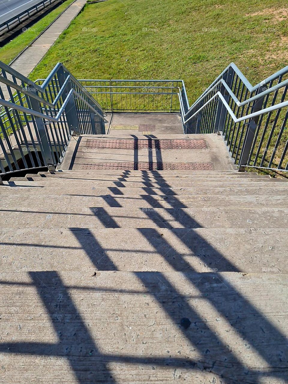 Multiverse: The serene repetition of the Iron railings of a staircase and its shadows