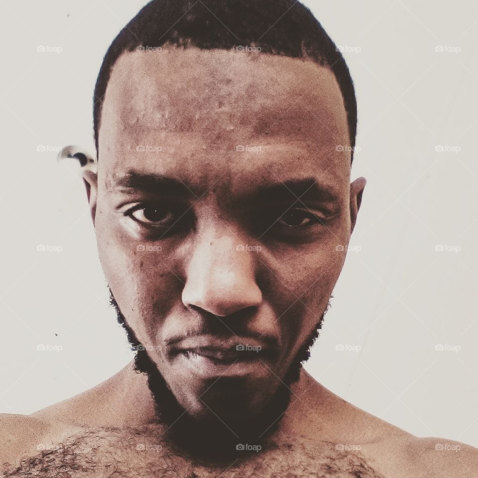 Picture of topless man with wolverine features