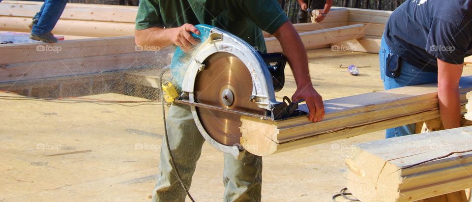 Man handling cutting machine