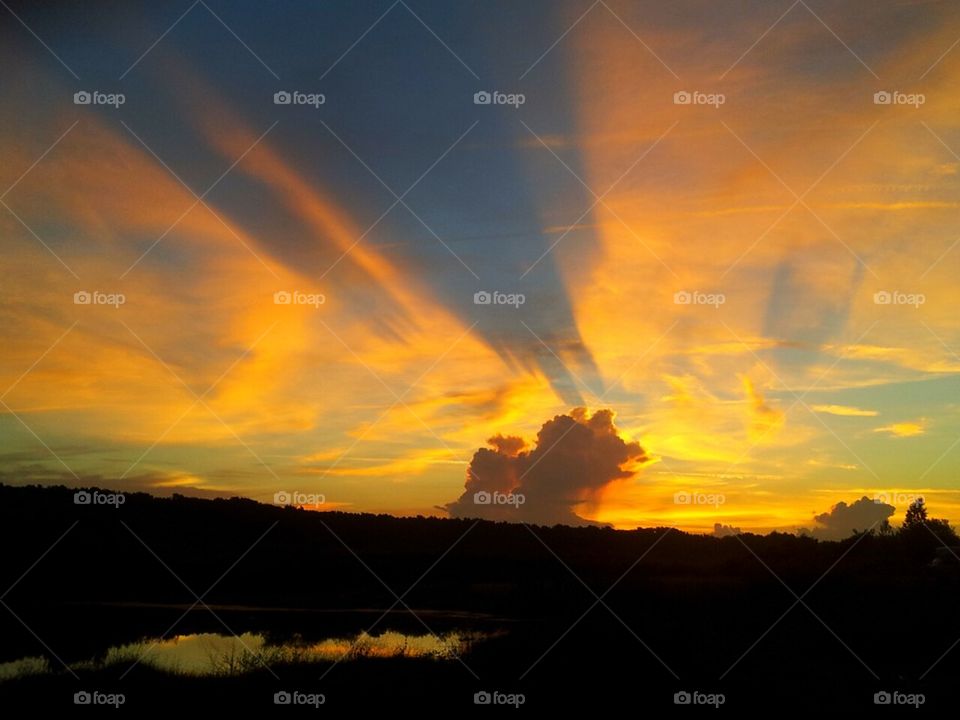 Clouds and sunrise on lake
