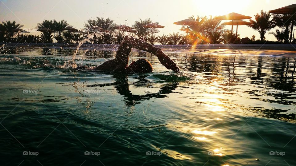 Man swimming in pool