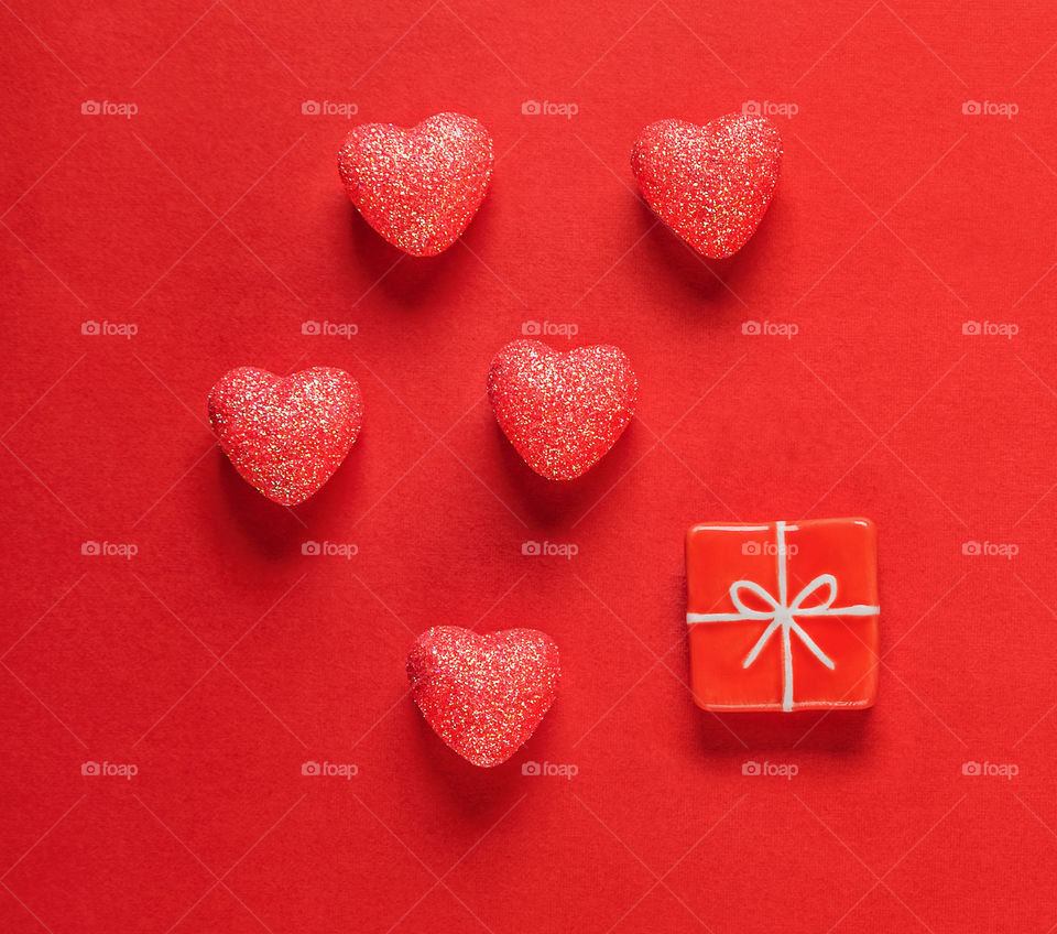 Red hearts on a red background. Valentine's Day. Postcard. Red pepper.