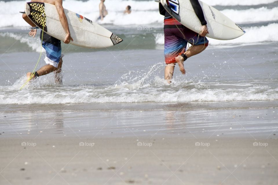 Surfers going to the water