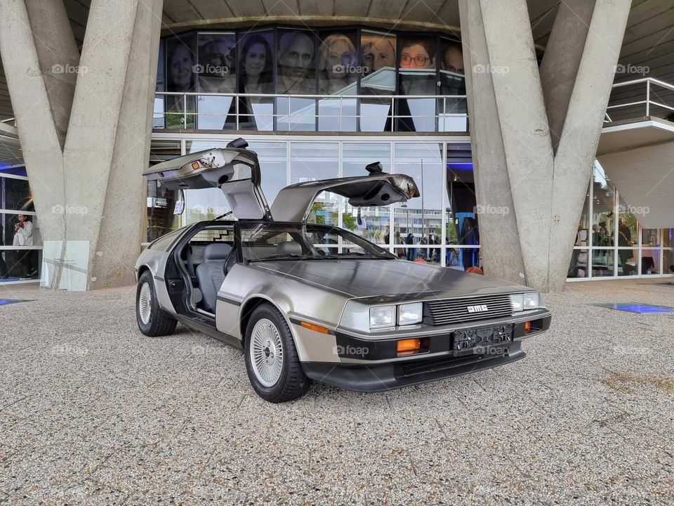 DeLorean DMC car, which was used as time travel device / time machine in the Back to the Future movie trilogy; with gullwing doors open