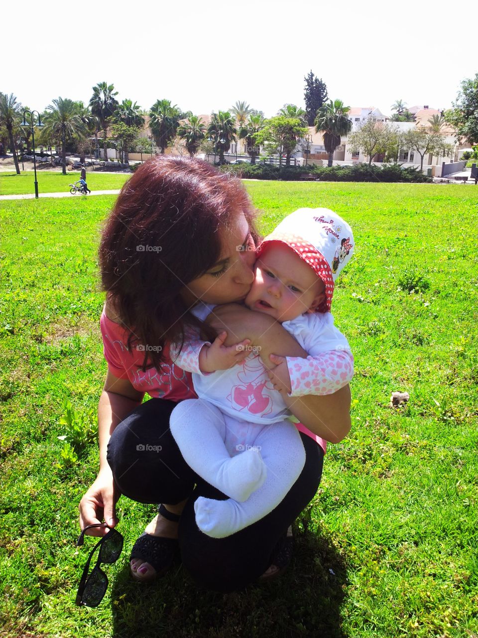 Mother's Love. Mother kissing her daughter