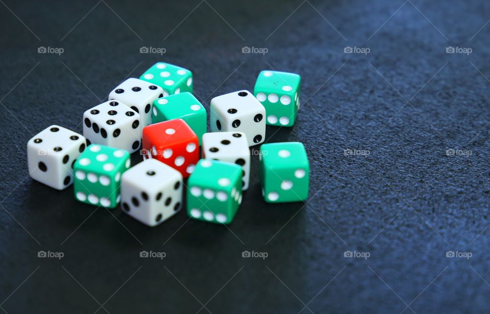 Handful of dice that are used at casinos for gambling