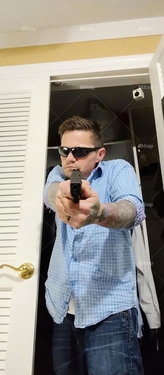 hot guy with fake gun
man pointing gun
hot cia agent
hot agent
sexy man with gun pointed
man in closet with gun