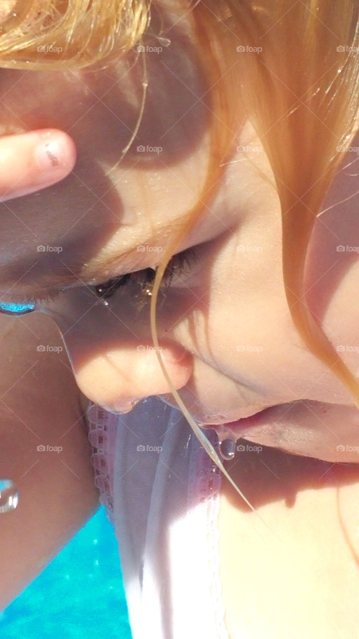 water dripping from face