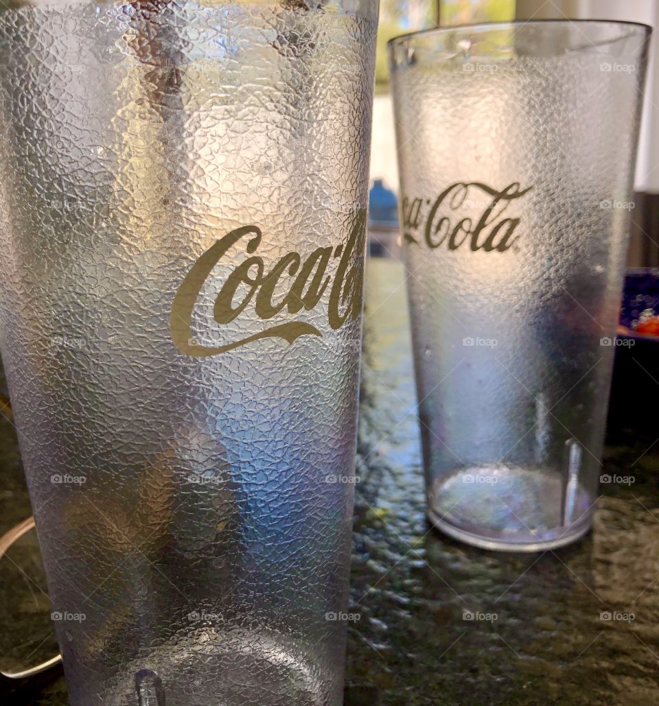 Closeup of Coca-Cola collectors drinking glasses 