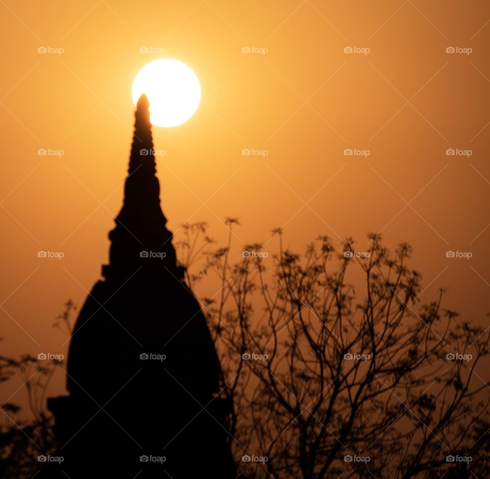 Bagun/Myanmar-April 14 2019:beautiful sunrise over  Pagoda field