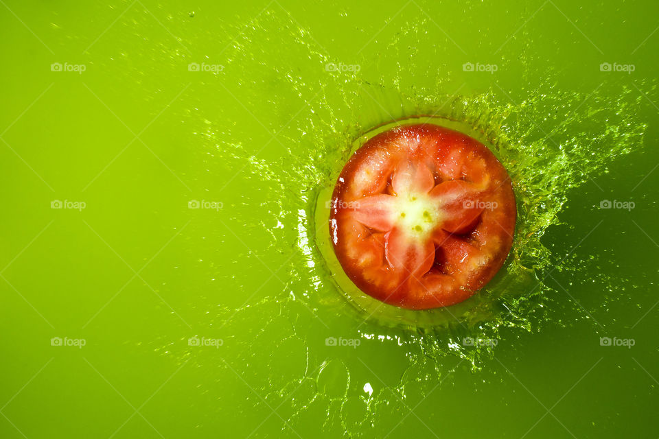 Sliced tomato on green