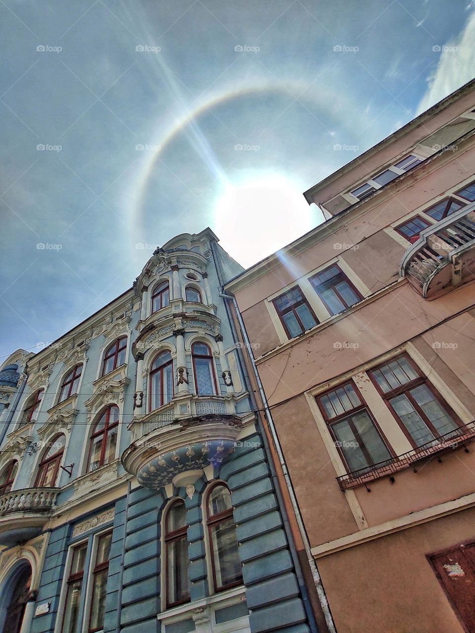 Halo over the ancient buildings of the city of Chernivtsi view from below