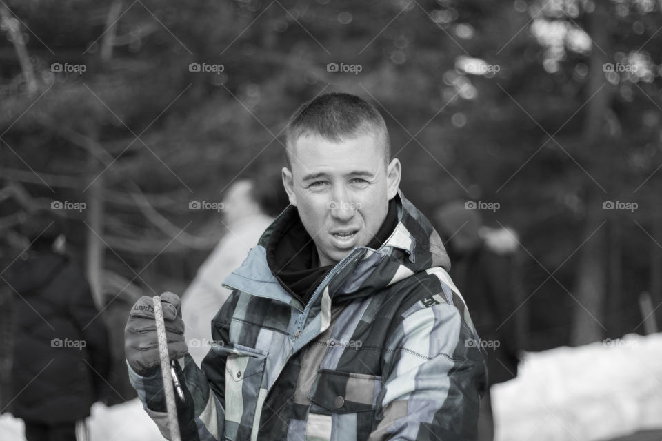 Boy with blue suit, playing in the snow