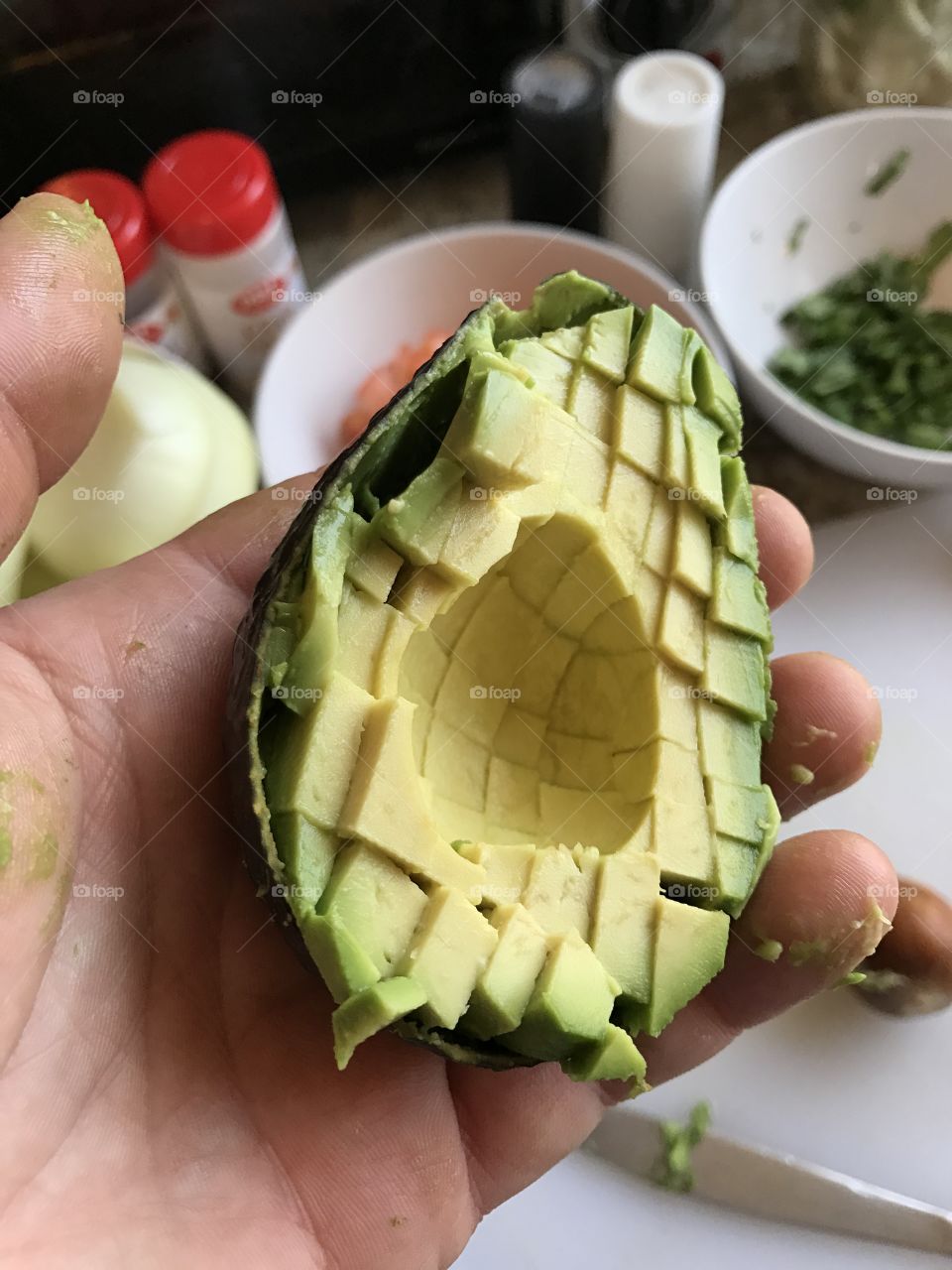 Avocado in hand for guacamole 