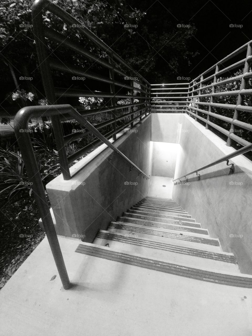 Going down? Black and white staircase leading to the underbelly of our dark and scary world