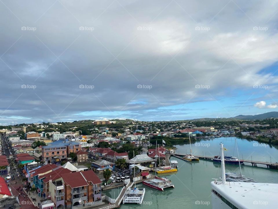 A white blanket of clouds overshadows the colorful buildings of this beach town. 