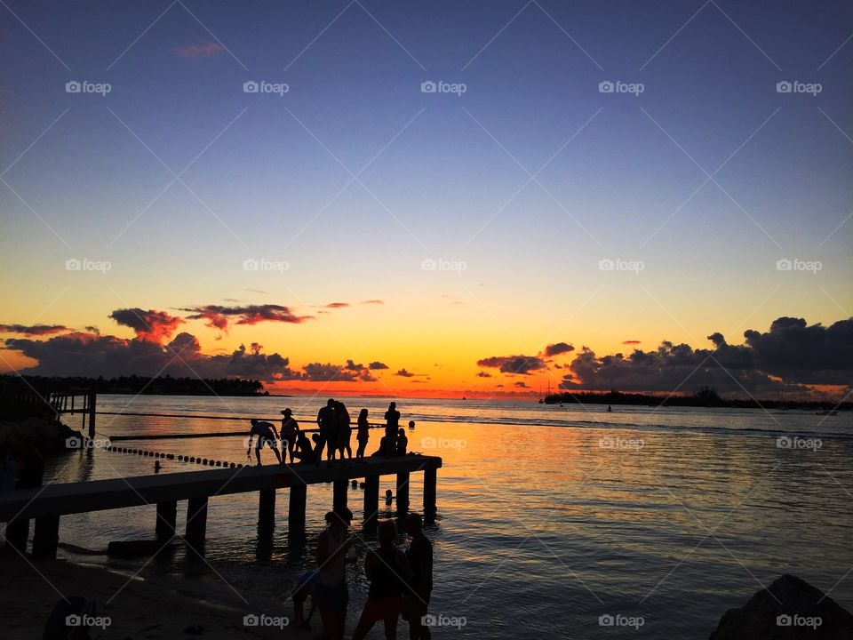 A cool summer evening in Key West, Florida, backed by a stunning sunset