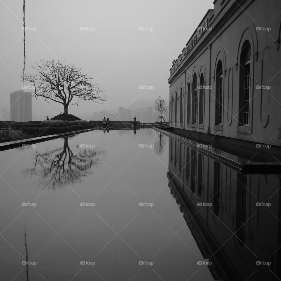 Hazy Sunset outside an old century Museum with the reflection of old buildings and other subjects.