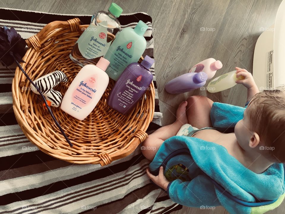 Baby playing with baby products 