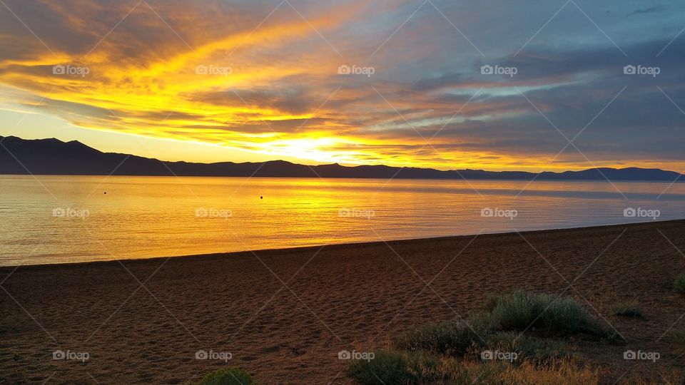 sunset from Lake tahoe beach. out to dinner in Lake tahoe enjoying the view