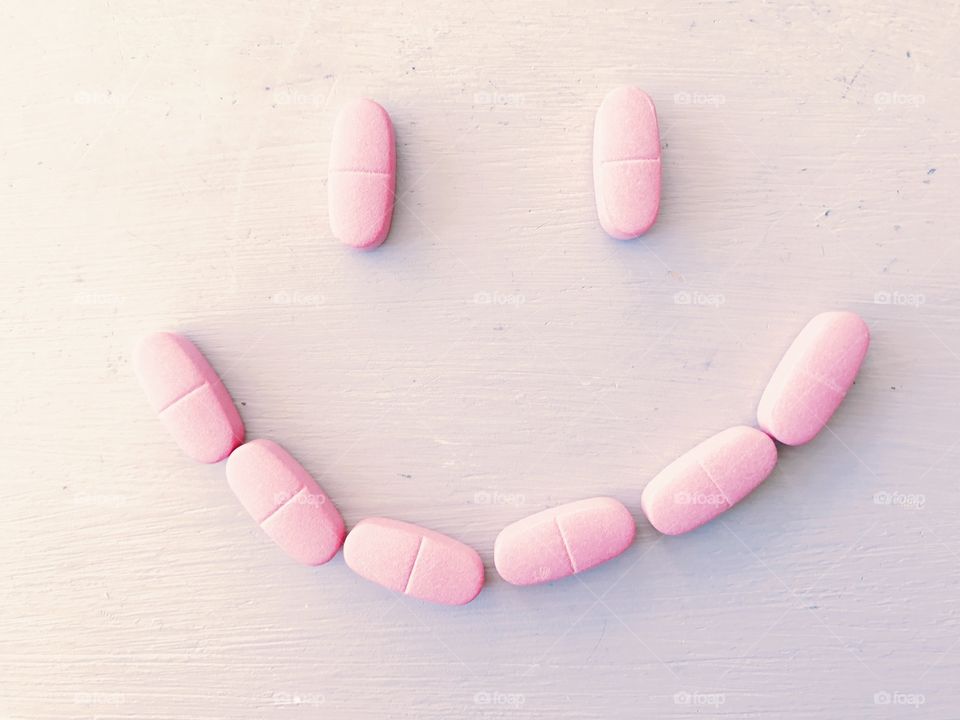 Pink smile made with tablets