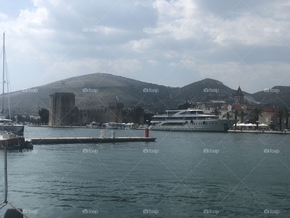 Nice view over a harbour in Croatia , nice view of the castle as well.